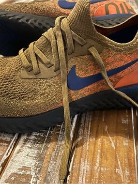 Nike Olive Knit Running Shoes with Blue Swoosh and Orange Accents